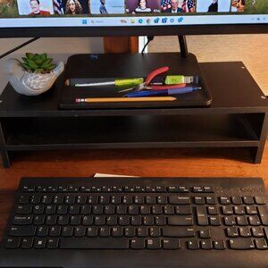 Desk monitor riser with shelf.